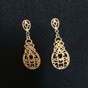 Gold chandelier earrings.